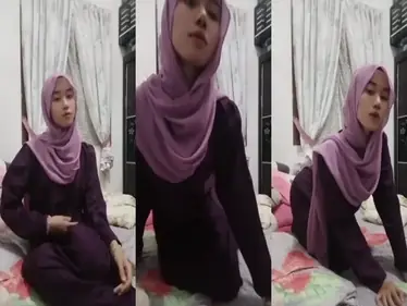Ukhti Hijab Cantik Bersantai Di Kasur Pink poster